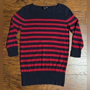 Tunic blouse with blue and red stripes.